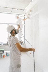 two professionals painting a wall in Monsey, NY